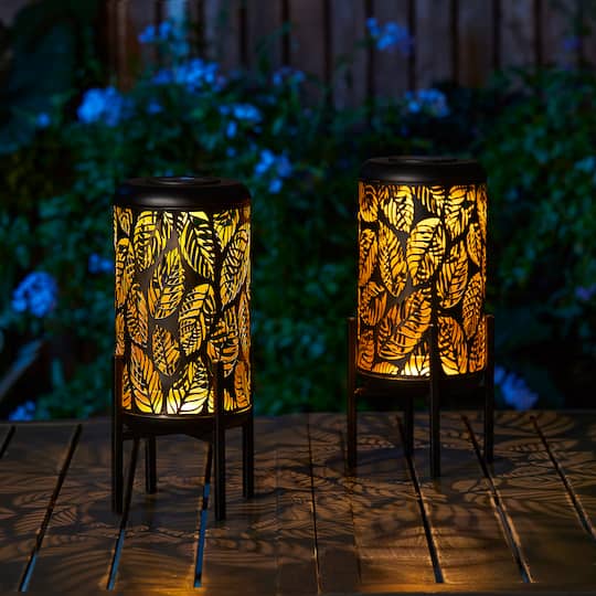 Glitzhome® 14.25" Black Metal Cutout Leaves Pattern Solar Powered LED Outdoor Lantern, 2ct.